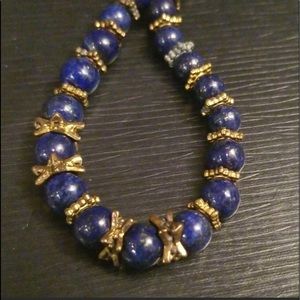 Stauer blue lapis necklace with gold accents.